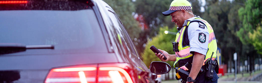 uniform officers engaging with driver