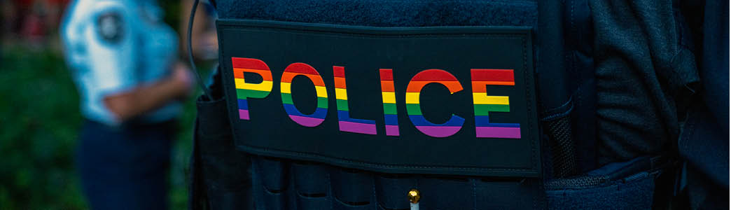 The words police in rainbow colours 