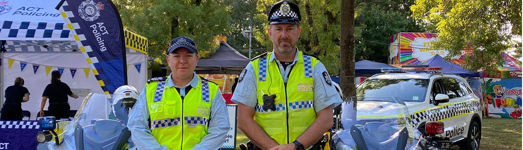 Two police officers in uniform standing at the Canberra Show 